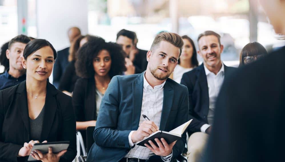 Emerging leaders learning from Learn2’s leadership development training.