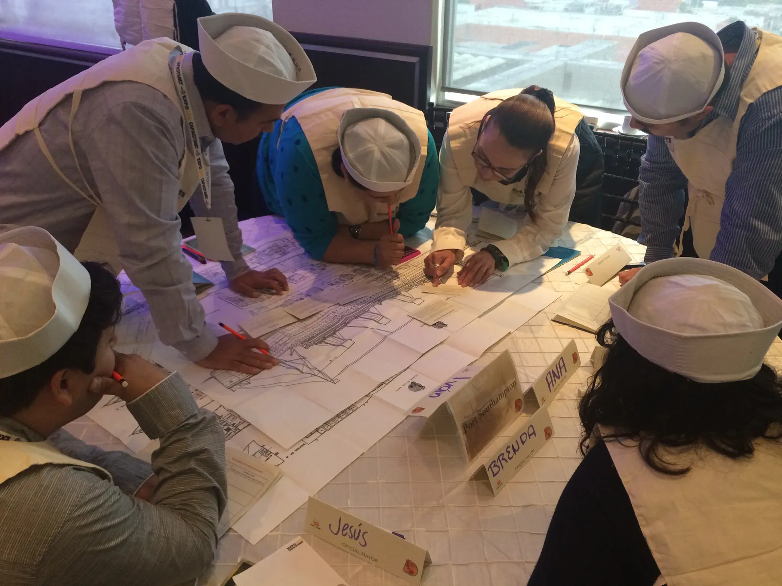 Participants building solutions hands-on during an immersive leadership experience
