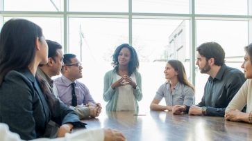 A boss using annoying workplace phrases with employees