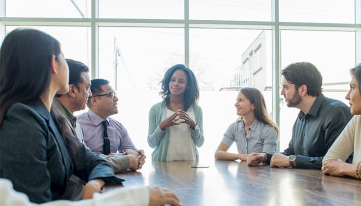 A boss using annoying workplace phrases with employees